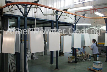 Unloading and quality control zone for metal panel powdercoating line